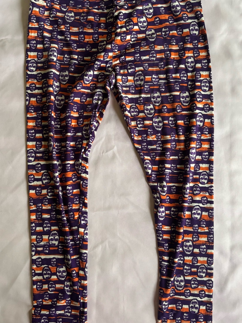 LuLaRoe Purple and Orange Skull Stripe Leggings